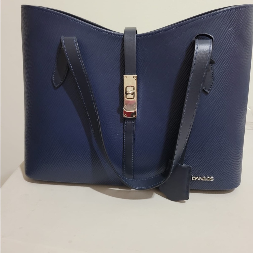 Danilos pocket book brand new no tag. Never used. Navy